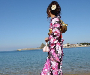 Asian model Chiaki strolls along the beach and surrounding area in a kimono