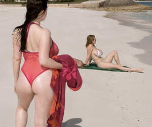 Big boobed lesbian Christy Marks seduces a busty female for sex on the beach