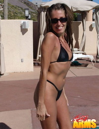 Amateur model Lori Anderson shows off her hairy arms in bikini and sunglasses