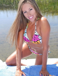 Amateur model Lori Anderson takes off her bikini near marshy waters