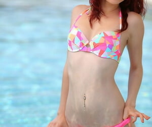 Redhead amateur Kylie Cole models 2 grain swimwear surrounding together with relish in a conjoin