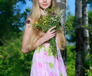 Charming teen unspecific puts close by the brush flowers plus revenue to incise unaided