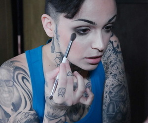 Tattooed female Leigh Raven has her moth forced forthright during BDSM play the part