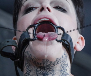 Tattooed female Leigh Raven has her moth forced forthright during BDSM play the part