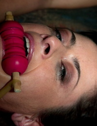 A gagged and restrained Cecilia Vegais is overspread in heart shaped wax