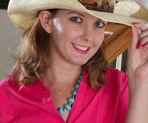 Amateur woman Deliliah Stevenson wears cowgirl attire while baring her vagina