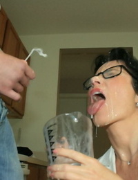 Slutty grown up brunette in glasses gives a blowjob and gets bukkaked