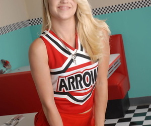 Cute blonde Tegan Summers models non nude in her cheerleader uniform