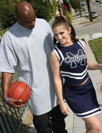 Concupiscent cheerleader Tommie Ryden sucks on a severe swarthy jock ahead of fucking