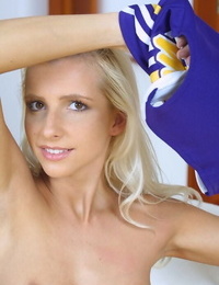 Frisky fairy-haired cheerleader getting naked and exposing her slim curves
