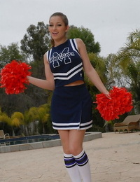 Juvenile cheerleader Dani Daniels pulls up her short skirt to equipment her gloryhole