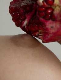 Young first timer Medina holds a pomegranate after fingering her tight slit