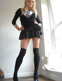 Hot blonde schoolgirl Elle Parker sheds uniform posing topless in lace panties