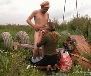 Dirty blonde woman comes across a homeless man and sucks his dick in a field