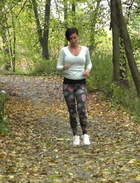 Female jogger Gabriellla Gucci pulls down her leggings for a pee in the woods
