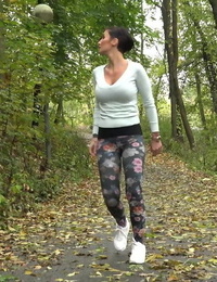 Female jogger Gabriellla Gucci pulls down her leggings for a pee in the woods