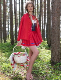 Teen amateur removes a Little Red Riding Hood outfit to get naked in the woods