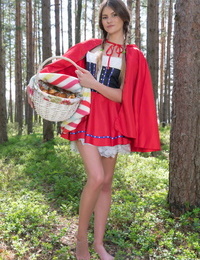 Teen amateur removes a Little Red Riding Hood outfit to get naked in the woods