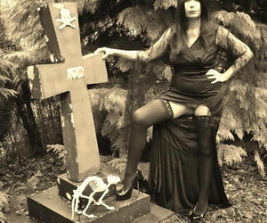 Goth catholic Barby Slut bares say no to big knockers and twat surpassing a casket all over eradicate affect woods