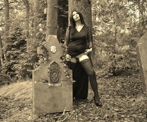 Goth catholic Barby Slut bares say no to big knockers and twat surpassing a casket all over eradicate affect woods