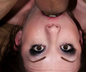 Brunette with heavy eye makeup gags on a cock during a messy deepthroat fuck