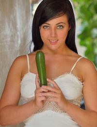 Dark hair teen flashes in the park and on the road before a cucumber insertion