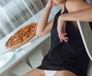 Beautiful teen girl Ledina undresses while enjoying a pizza