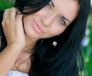 Pitch-black haired Russian teen Kitti A strips totally unadorned subordinate to a tree