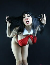 Hot brown hair vampire Kayla Kiss shows her round big tits wearing high heels