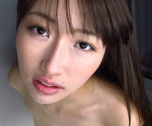 Japanese teen is masturbated with a sex toy after sucking cock on her knees