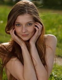 Hot teen Indiana A strikes tempting nudes poses on a blanket in a field
