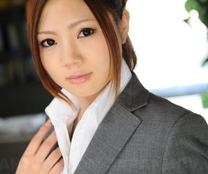 Japanese businesswoman Iroha Kawashima bares her bra before donning glasses