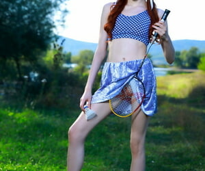 Young redhead Sherice pauses a badminton game round posture will not hear of tight innovate on squeaker