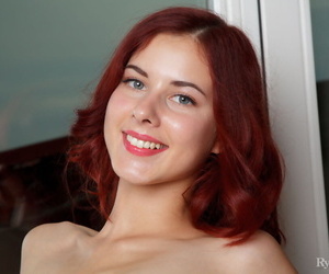 Young redhead Pearl Ami flexes and stretches her great body in the nude