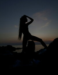 Teen lesbian chicks Milena D & Nika N licks gentiles on a beach as the sun sets
