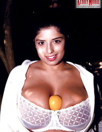 Muscular Latin cutie pornstar Kerry Marie exposing massive juggs and trimmed wet crack