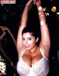 Muscular Latin cutie pornstar Kerry Marie exposing massive juggs and trimmed wet crack