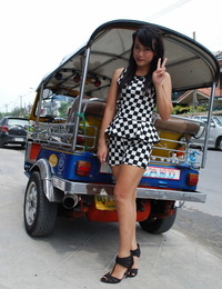 Cut Thai girl with a pleasing face poses for candid shots on the street