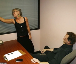 Mature secretary in glasses gives a great blowjob to her boss