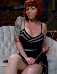 Tattooed redhead Kylie Ireland flashes an upskirt butt self-possession on a Davenport