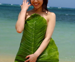 Busty asian babe Adusa Kyono slipping off her bikini outdoor