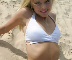 Petite teen Skye Model crippling X-rated white bikini increased by flip flops laze about