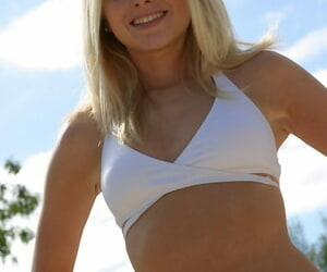 Petite teen Skye Model crippling X-rated white bikini increased by flip flops laze about