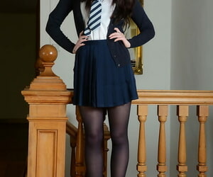 Cute schoolgirl Jessica-Ann Fegan modeling non unveil on every side nylons together with skirt