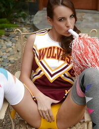Beautiful babe Jenna Rose posing in a cheerleader outfit
