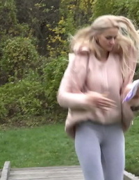 Blonde Katy Sky shows her bald beaver while squatting outside for a pee