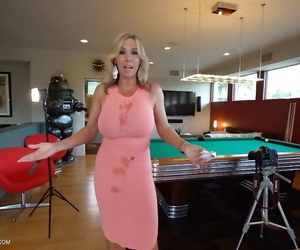 Clothed blonde housewife Sandra Otterson modeling on balcony and pool table