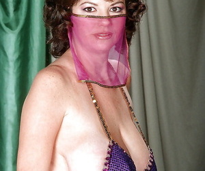 Adult Greek woman Diane Poppos letting big hanging titties fall easy