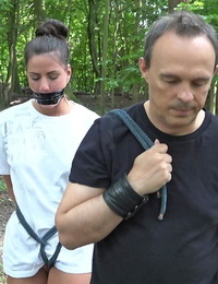 Young brunette slave is disciplined and fucked in the forest by her Master