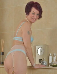 Short haired mature dame Penny Brooks using sex toy on wet pussy